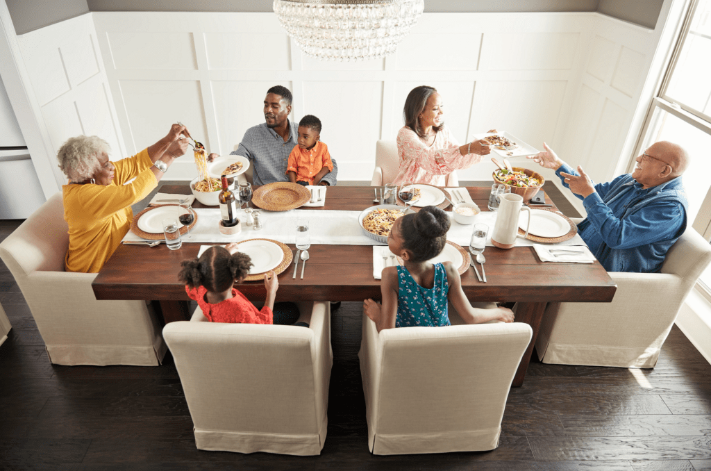 Family having breakfast at the dining table | Dalton Wholesale Floors